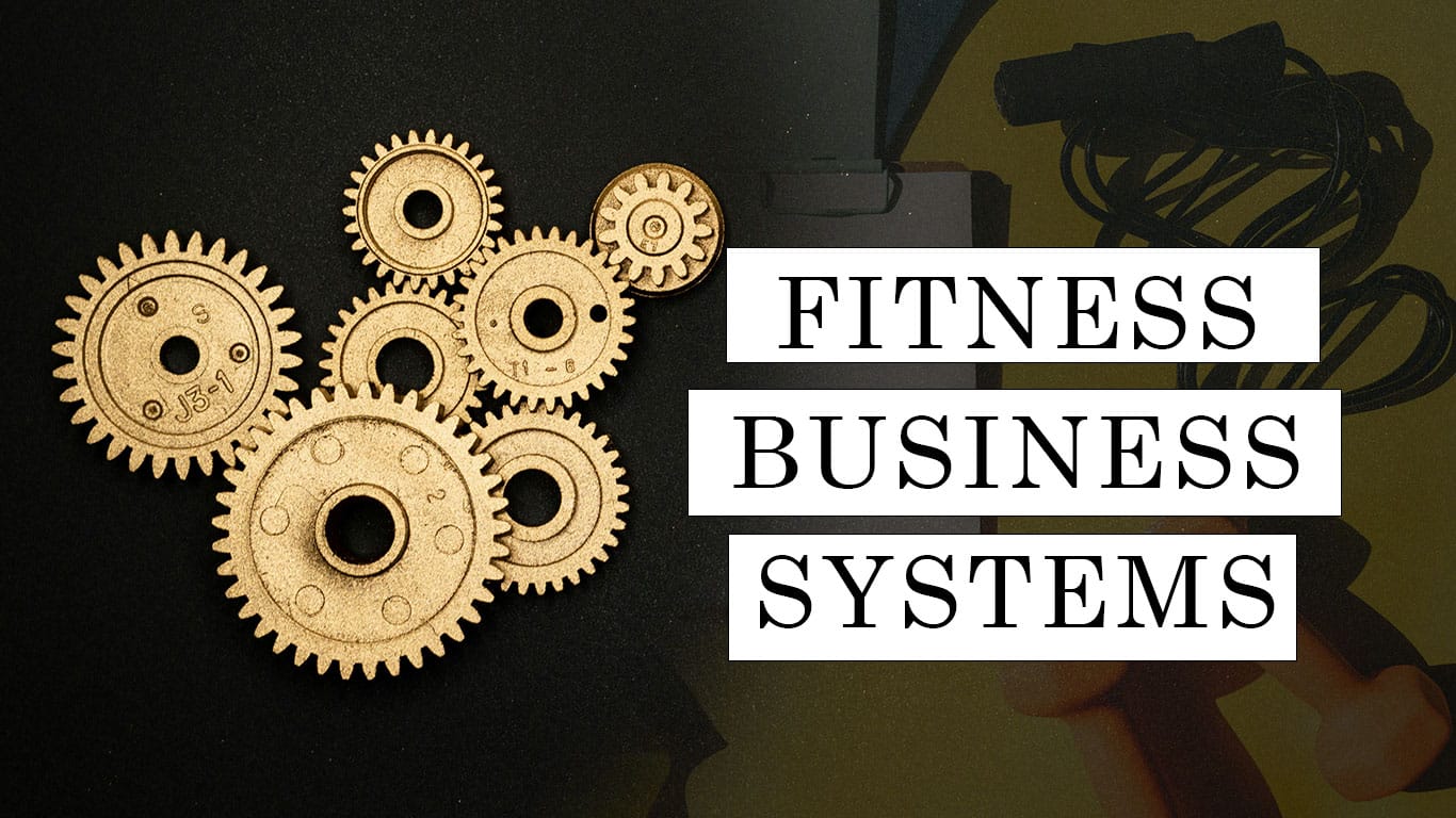 Wooden gears on a dark surface with the text "Fitness Business Systems" on the right
